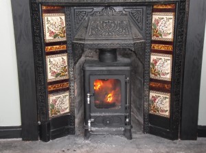 This little stove is a great example of what will fit into a traditional Victorian insert. The insert was removed,the back cut off and with some alterations to the fireplace the stove was fitted with a liner.This one produces 4.9kw and is multi fuel.