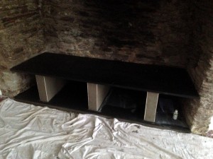 A New slate shelf has been fitted with pillars for support.