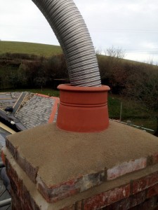 The new chimney pot is fitted with new flaunching and leadwork.
