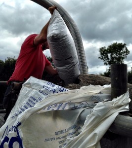 After Removal and the installation of a new Steel Register plate,vermeculite insulation is poured down the chimney to insulate it.